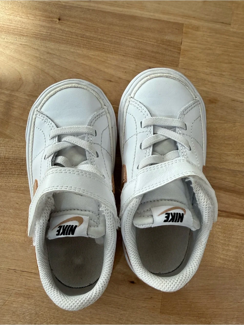 Nike Kids White Sneakers with Metallic Gold Swoosh
